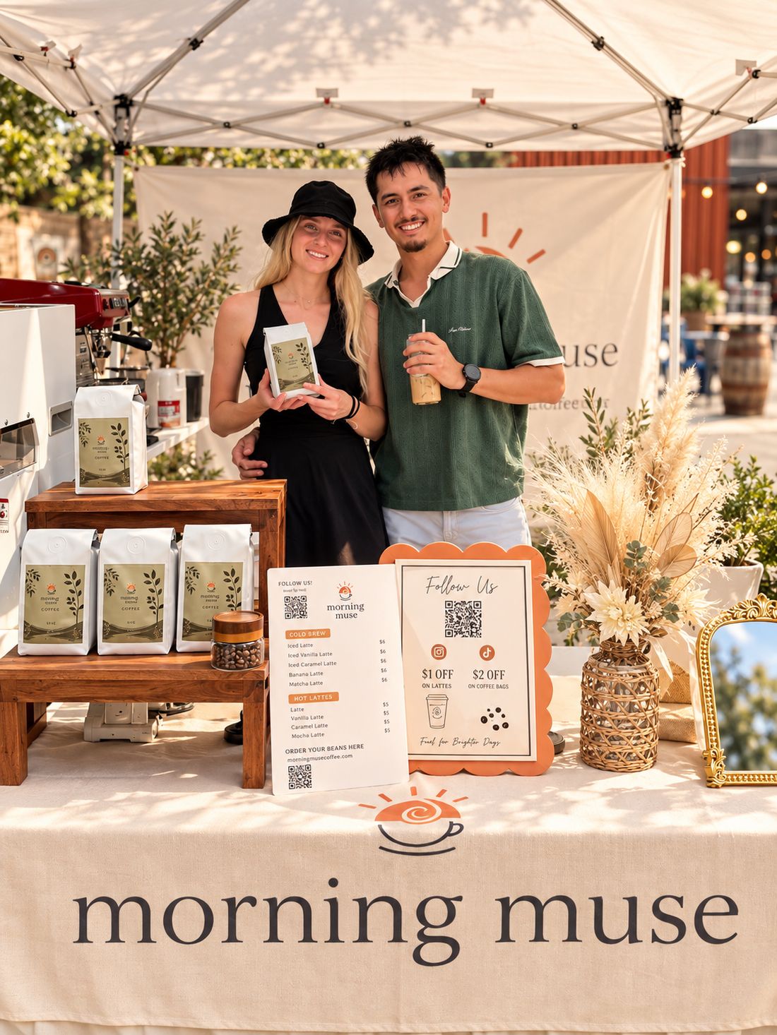 Brandon and Elena behind the Morning Muse market booth